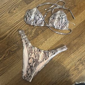 Vitamin A Snakeskin bikini. Triangle top and high leg bottoms. Worn once